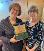Erica and Mary pose with the award.