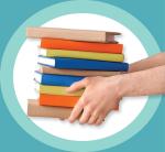 Image of a person holding a stack of books