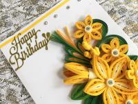 Card with paper quilling design.